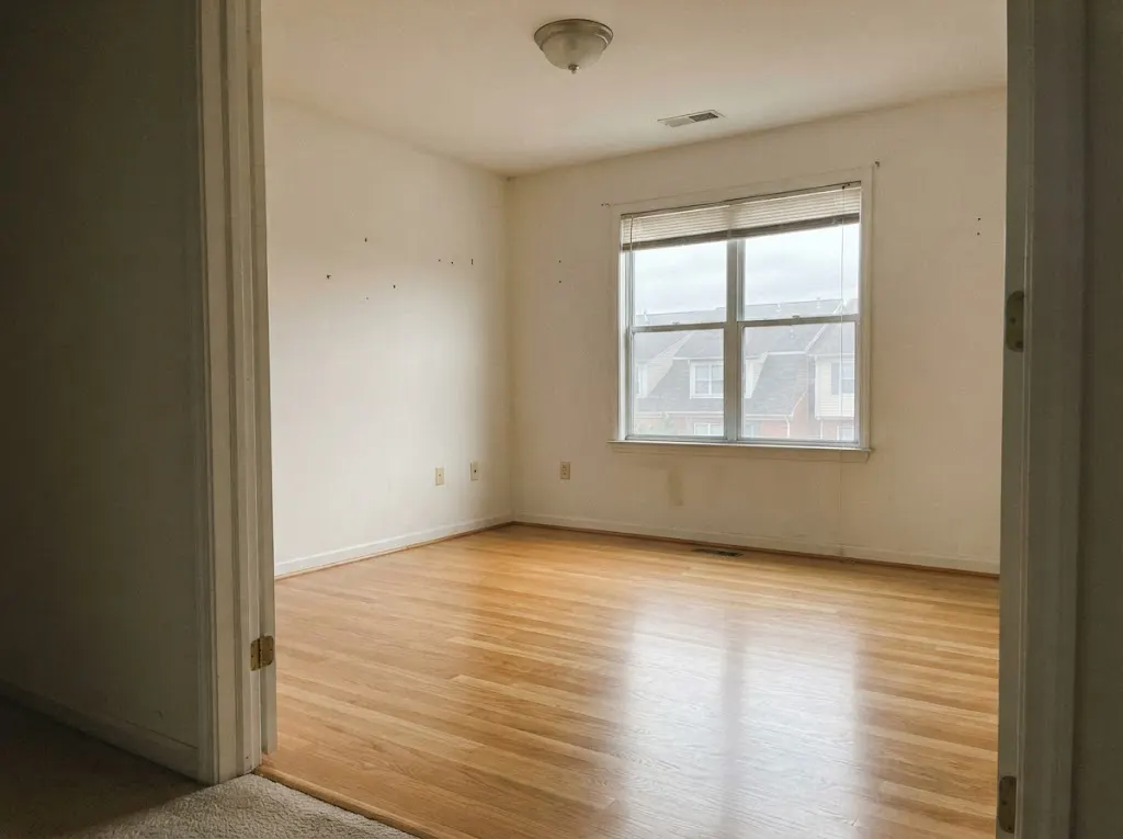 Oak bedroom floor after a move-out cleaning in a rental townhouse (hardwood deep cleaning in Newport News, VA)