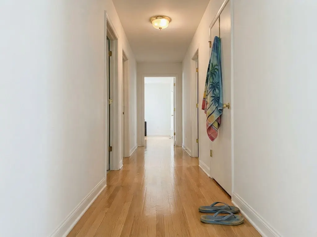 Freshly cleaned light oak hallway floor in a beach rental house (hardwood deep cleaning in Virginia Beach, VA)