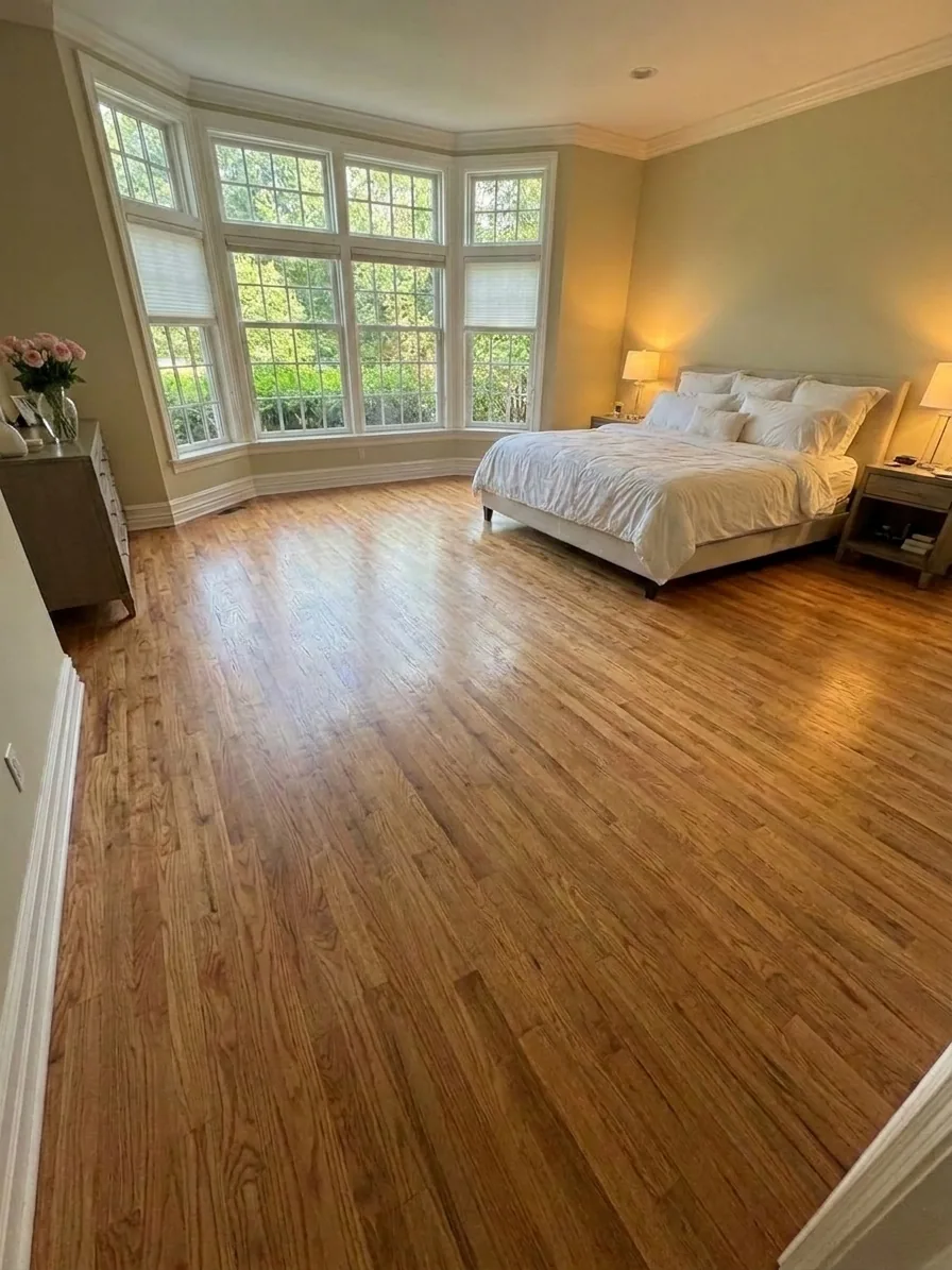 Worn red oak floors before refinishing at Ford's Colony Williamsburg